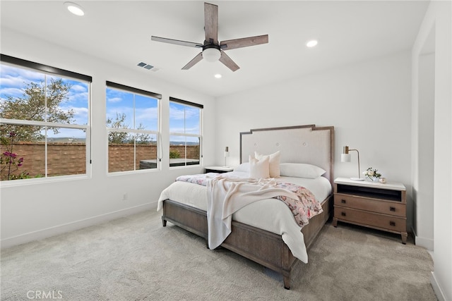 bedroom featuring light carpet, baseboards, visible vents, and recessed lighting