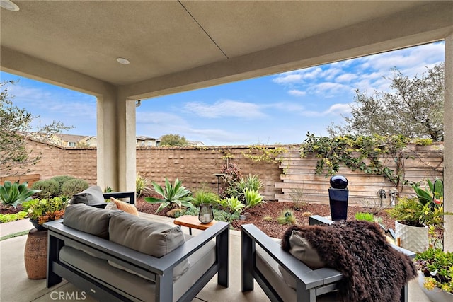 view of patio / terrace featuring outdoor lounge area and a fenced backyard