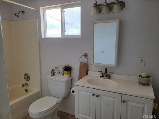 bathroom featuring vanity, toilet, and bathtub / shower combination