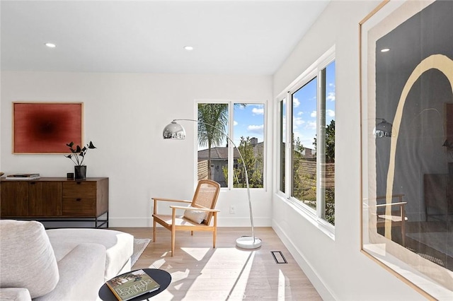 interior space featuring recessed lighting, light wood-type flooring, visible vents, and baseboards