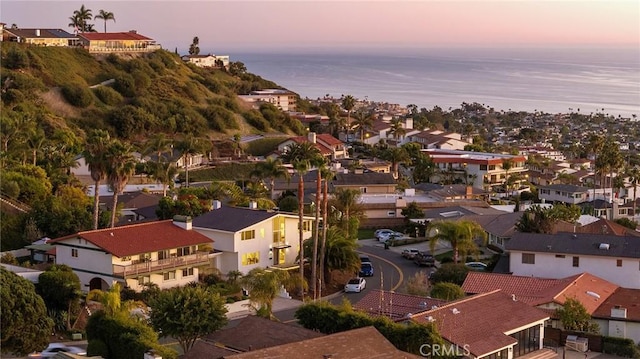 aerial view with a water view and a residential view