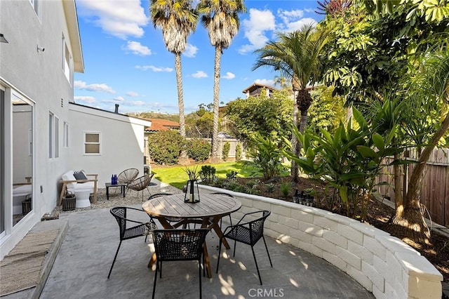 view of patio / terrace with a fenced backyard and outdoor dining space