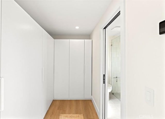 hallway with light wood-style flooring