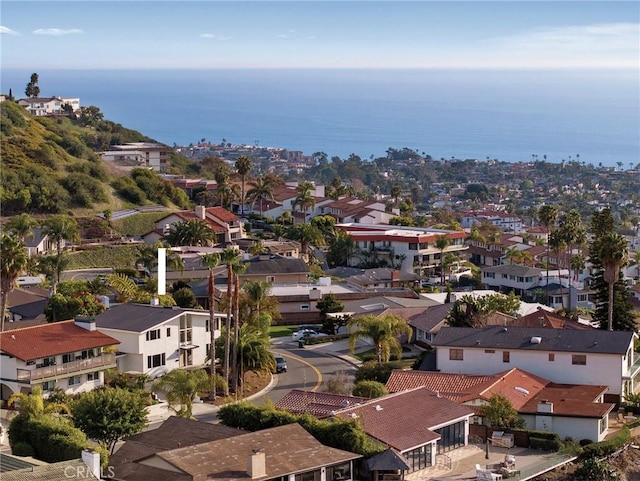 birds eye view of property with a water view and a residential view