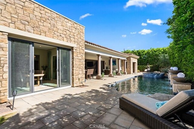 pool with a patio area