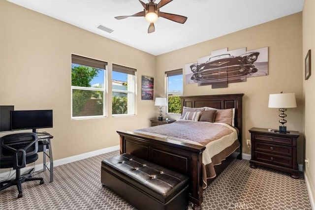 bedroom featuring a ceiling fan, carpet, visible vents, and baseboards