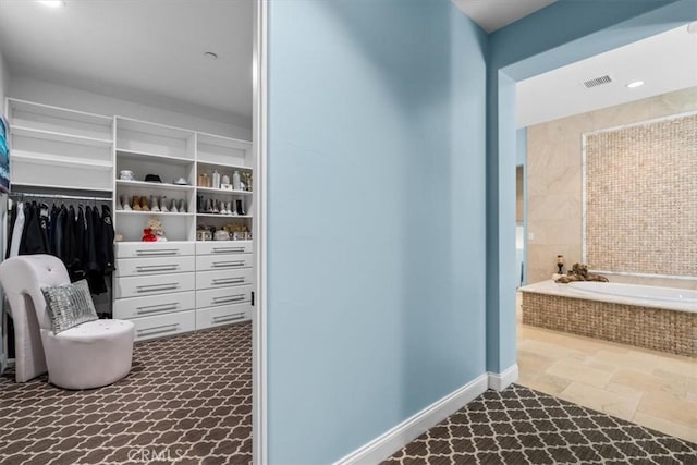 interior space with stone finish floor and visible vents