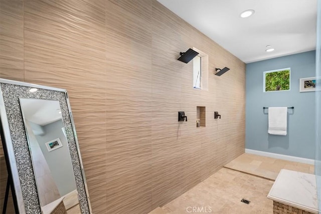 full bathroom featuring tile walls, recessed lighting, tiled shower, and tile patterned floors