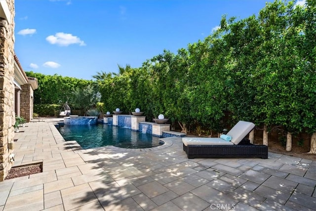 pool featuring a patio area