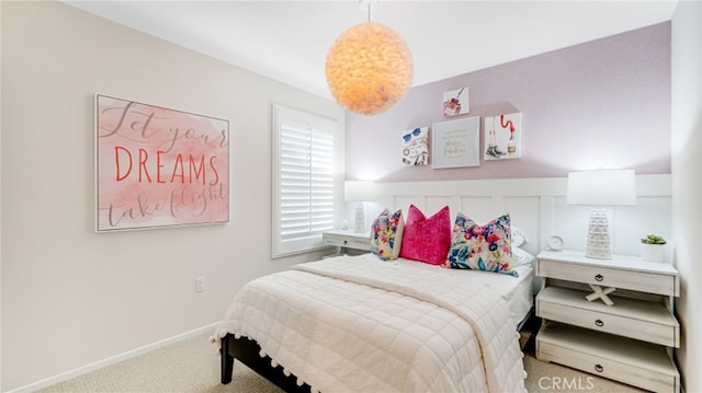 carpeted bedroom with baseboards