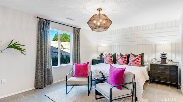 bedroom with visible vents, baseboards, and light tile patterned floors