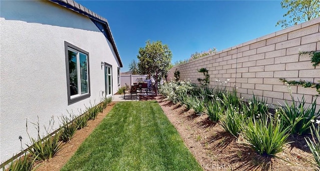 view of yard with a fenced backyard