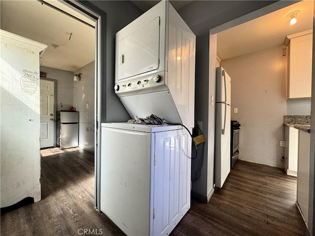 4868 La Roda Ave, Los Angeles, CA 90041 - washroom featuring stacked washer / dryer and dark wood finished floors