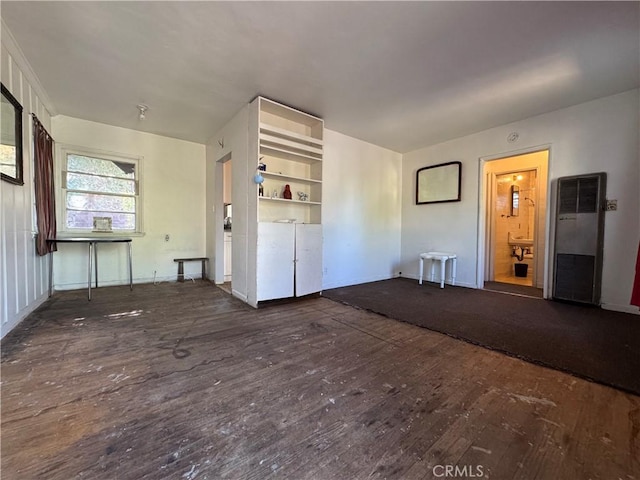 4868 La Roda Ave, Los Angeles, CA 90041 - unfurnished living room with a heating unit, hardwood / wood-style floors, and baseboards