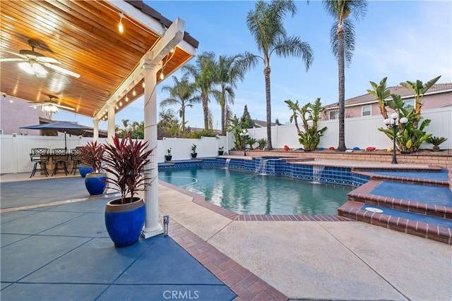 view of pool featuring a patio, a fenced backyard, a jacuzzi, a ceiling fan, and a fenced in pool