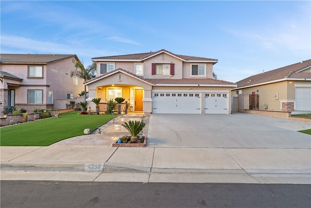 traditional-style home featuring a tile roof, stucco siding, concrete driveway, a front yard, and a garage