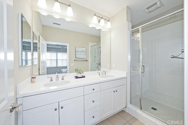 full bathroom featuring ensuite bath, a sink, and visible vents