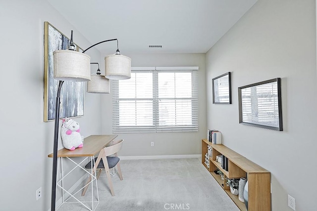 office space with light carpet, visible vents, and baseboards