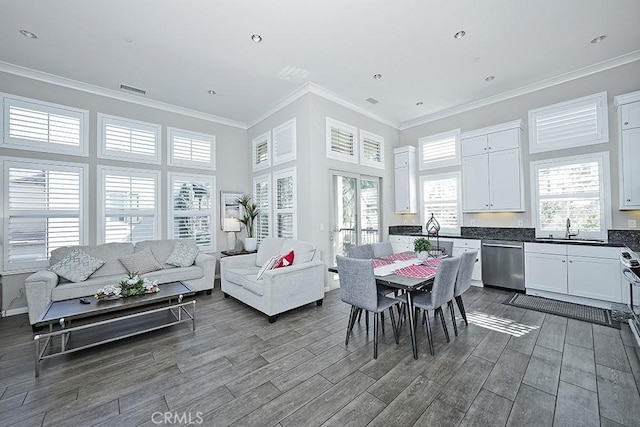 interior space featuring a sink, visible vents, and a healthy amount of sunlight