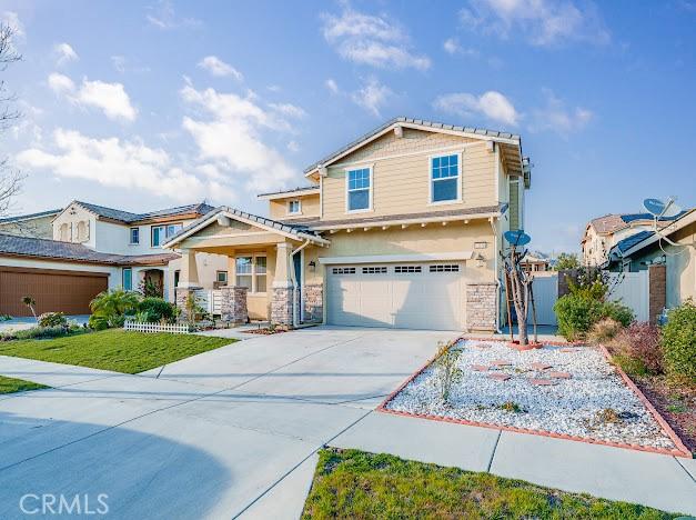 view of front of property with concrete driveway and an attached garage