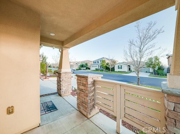 view of patio with a residential view and covered porch