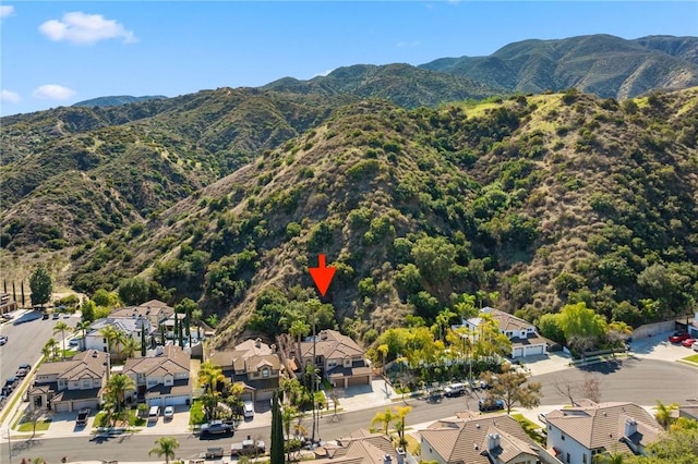 drone / aerial view with a residential view and a mountain view