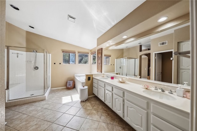 full bathroom with tile patterned flooring, visible vents, and a sink