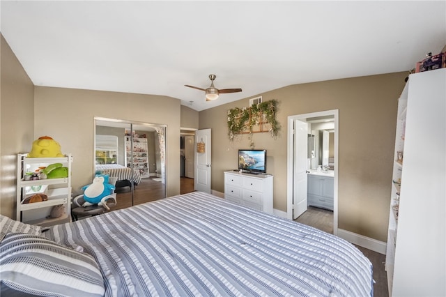 bedroom featuring a closet, visible vents, a ceiling fan, vaulted ceiling, and baseboards