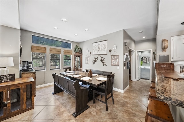 dining area with light tile patterned floors, baseboards, and recessed lighting