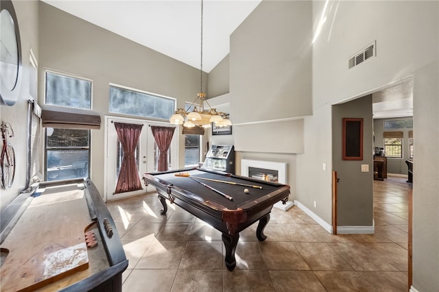 game room featuring pool table, visible vents, a warm lit fireplace, baseboards, and tile patterned floors