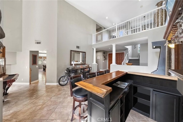 dining space with visible vents, baseboards, and light tile patterned floors