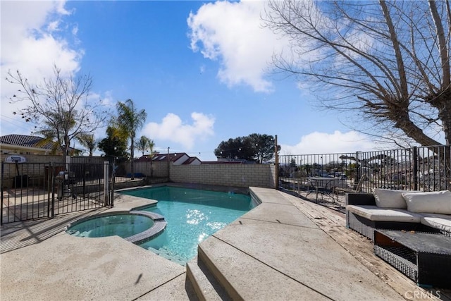 view of pool with a fenced backyard, a pool with connected hot tub, and a patio