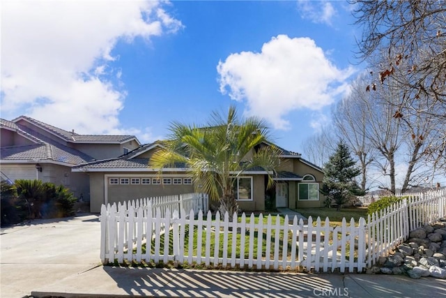 view of front of house with an attached garage, stucco siding, concrete driveway, and a front yard