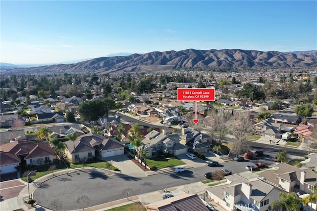 birds eye view of property featuring a residential view and a mountain view