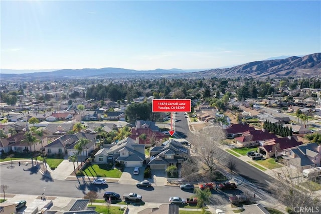 bird's eye view with a residential view and a mountain view