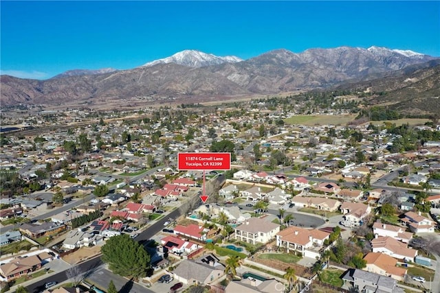 exterior space with a residential view and a mountain view