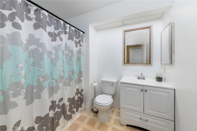 bathroom featuring toilet, tile patterned floors, a shower with shower curtain, and vanity