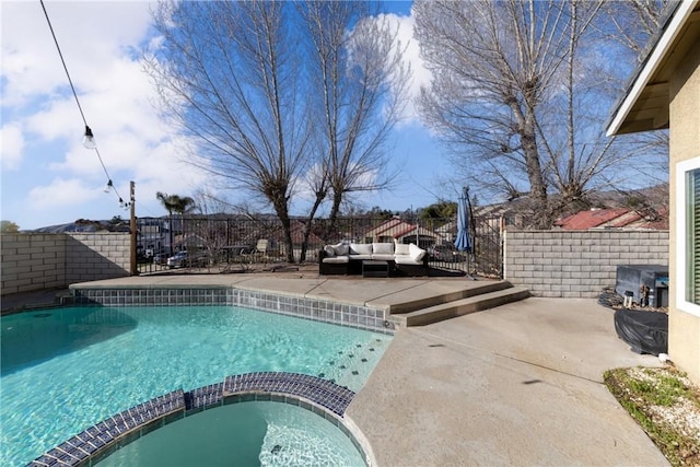 view of pool with a pool with connected hot tub, a fenced backyard, a patio, and an outdoor hangout area