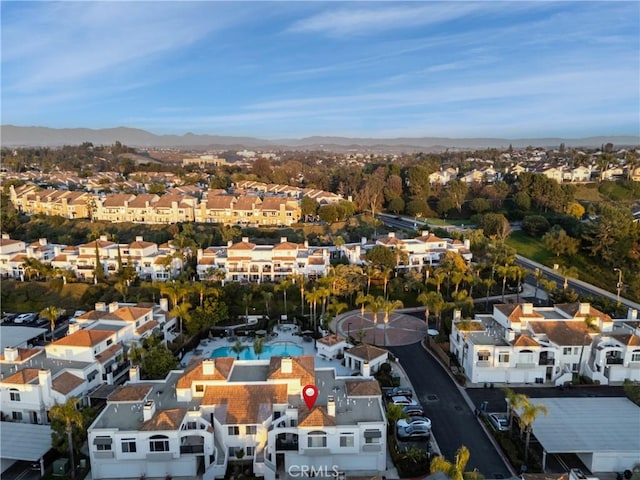 birds eye view of property featuring a mountain view and a residential view