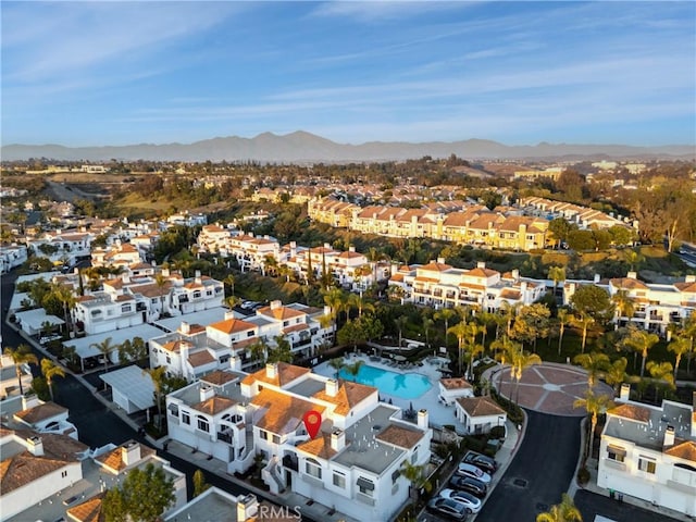 birds eye view of property with a residential view and a mountain view