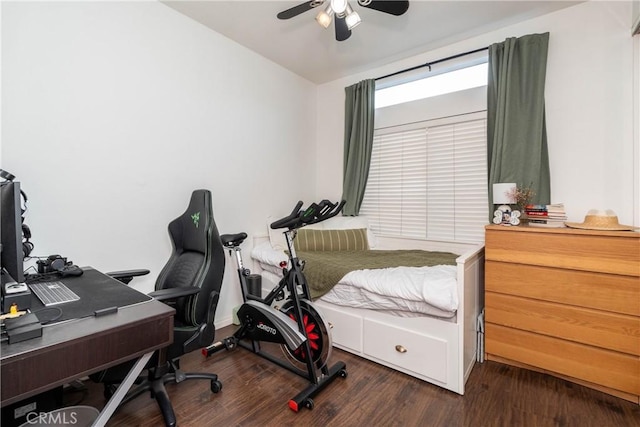 bedroom featuring a ceiling fan and dark wood-style flooring