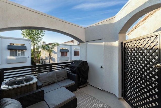 view of patio with cooling unit, a balcony, and area for grilling