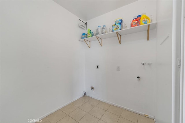 laundry room with hookup for a washing machine, laundry area, hookup for an electric dryer, and light tile patterned floors