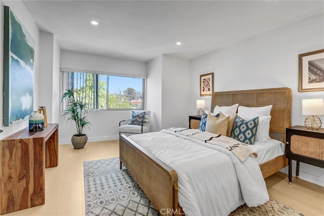 bedroom featuring recessed lighting, light wood-style flooring, and baseboards