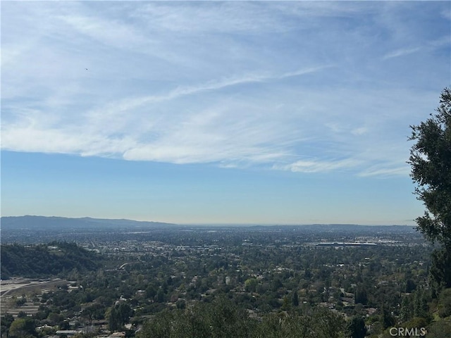 exterior space with a mountain view and a wooded view