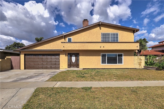 view of front of property with a garage, a front yard, driveway, and stucco siding