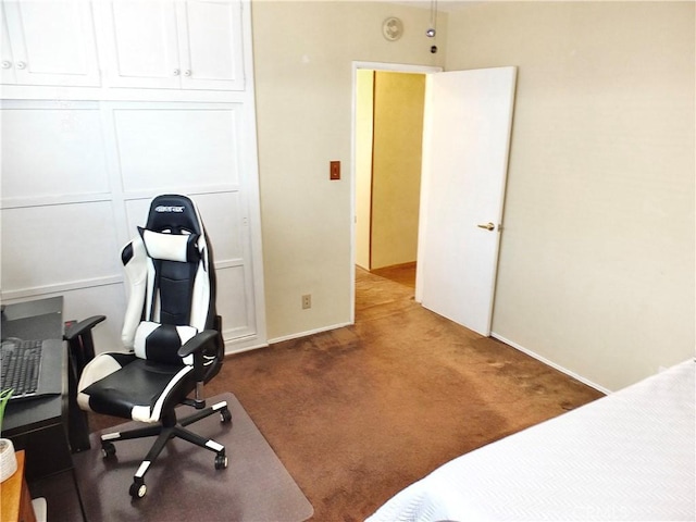 bedroom featuring baseboards and dark colored carpet