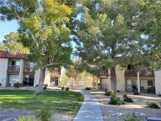 surrounding community featuring a yard
