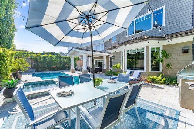 view of patio / terrace with outdoor dining area and a fenced in pool