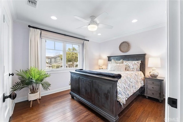 bedroom with baseboards, visible vents, dark wood-style flooring, and ornamental molding